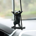 Cartoon-style resin cat pendant for car interior decoration with adjustable rope.
