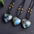 Natural labradorite moonstone crystal necklace with geometric blue pendant on a silver chain.