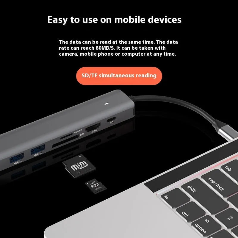LQT-LH07 7-in-1 USB-C computer hub with card readers and charging port on a desk.