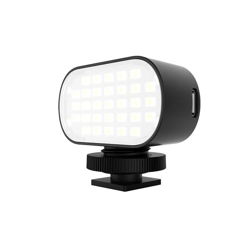 ST-30 black mobile phone fill light with digital display and cold shoe mount on a stand