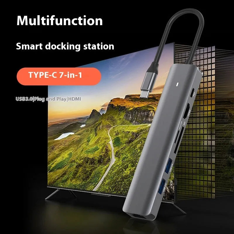 LQT-LH07 7-in-1 USB-C computer hub with card readers and charging port on a desk.