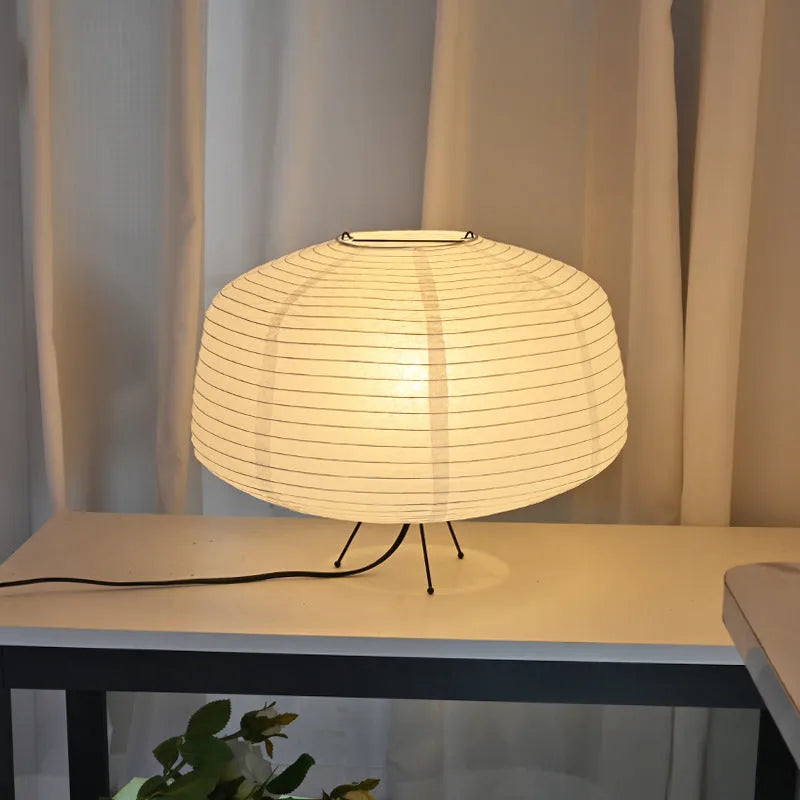Japanese style xuan paper desk lamp with three-colour light source on a wooden desk in a bedroom