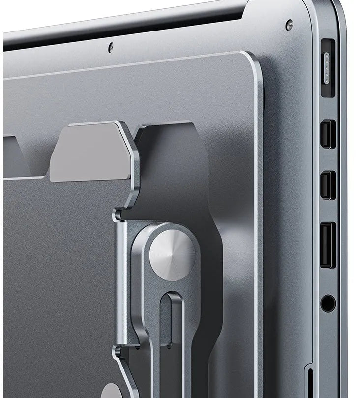 Grey aluminium adjustable laptop stand in folded position showing hollow design and silicone pads
