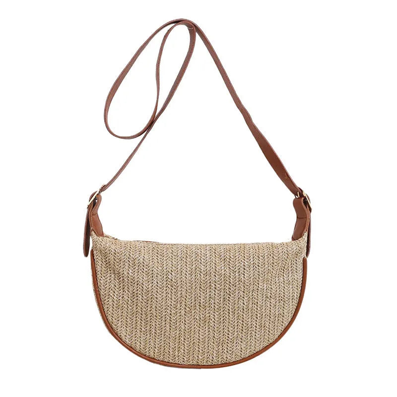 Women's woven straw crossbody bag showing internal phone pocket and file compartment in corrugated black colour