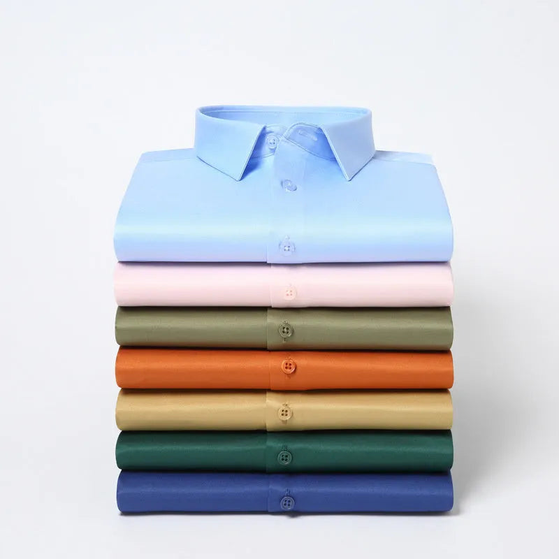 Man wearing a solid colour long-sleeved non-ironing shirt made from elastic polyester spandex fabric.