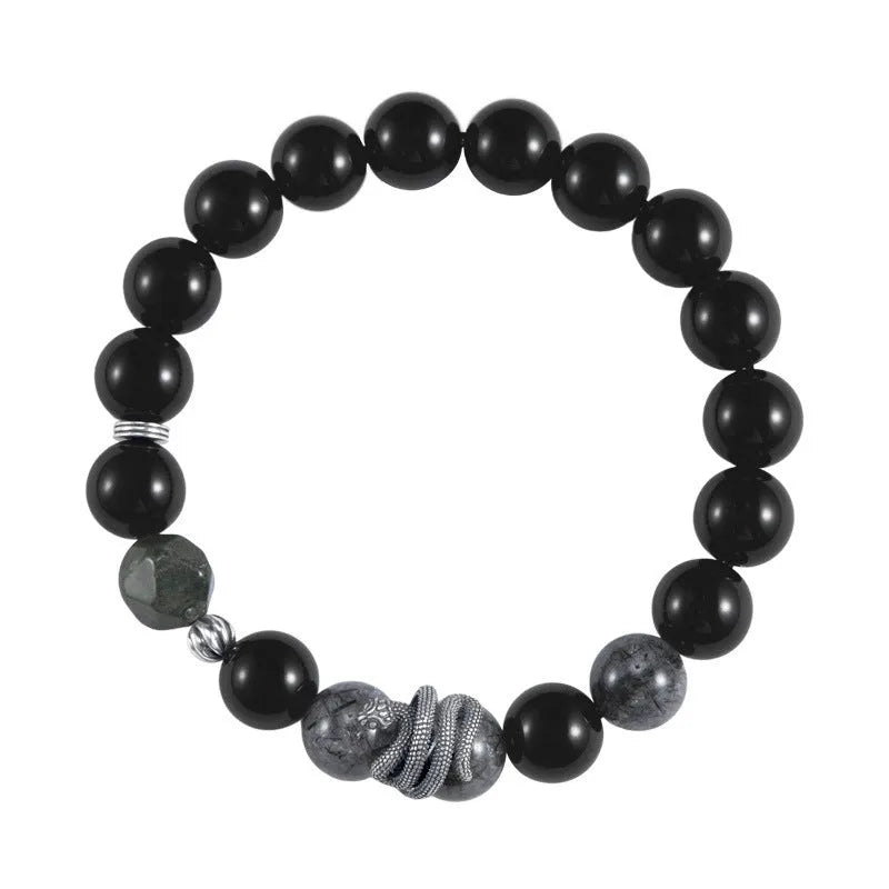 S925 sterling silver men's bracelet with black obsidian crystal and detailed snake design on a wrist.