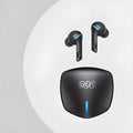 Grey QCY-G1 wireless in-ear gaming headset and its portable charging case on a table.