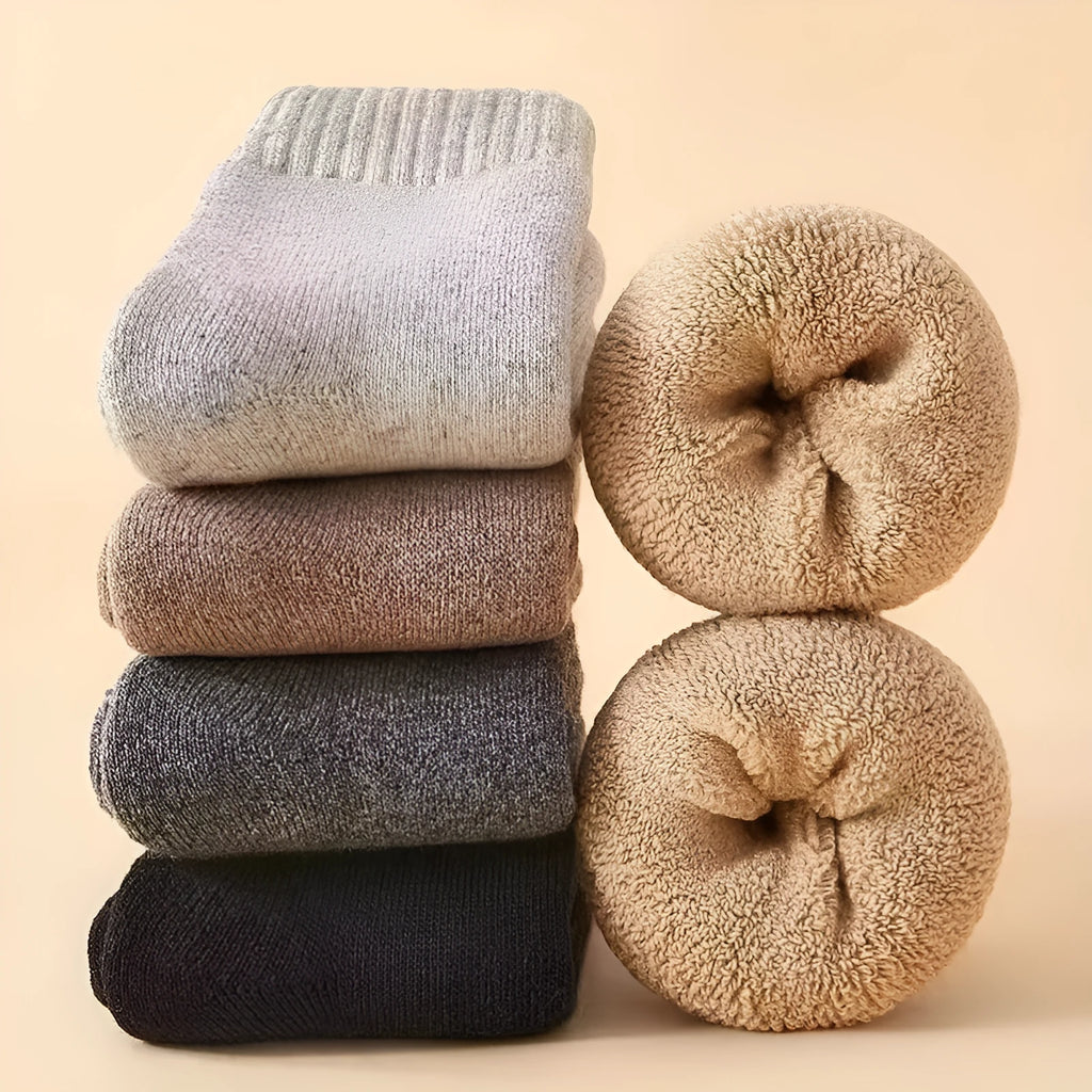 Pair of thick, solid-colour wool socks with a knitted texture, shown in a dark grey colour.