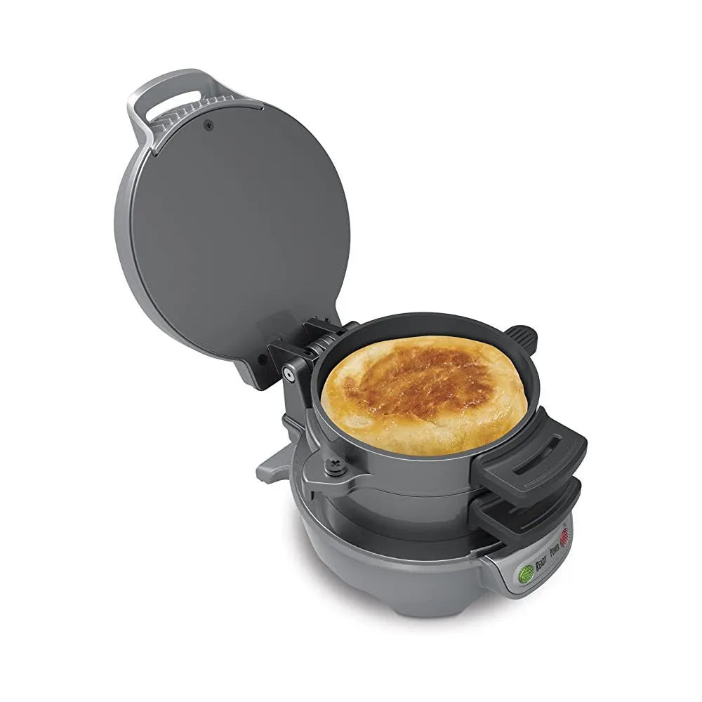 Bright red breakfast machine with egg cooker ring and sandwich plates on kitchen counter