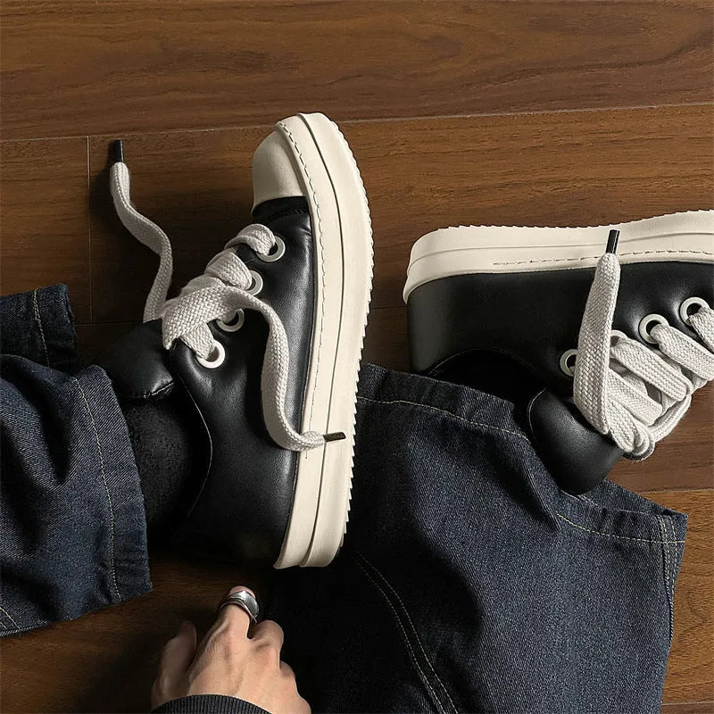 Men's black leather slip-on casual shoes with round toe and flat rubber soles