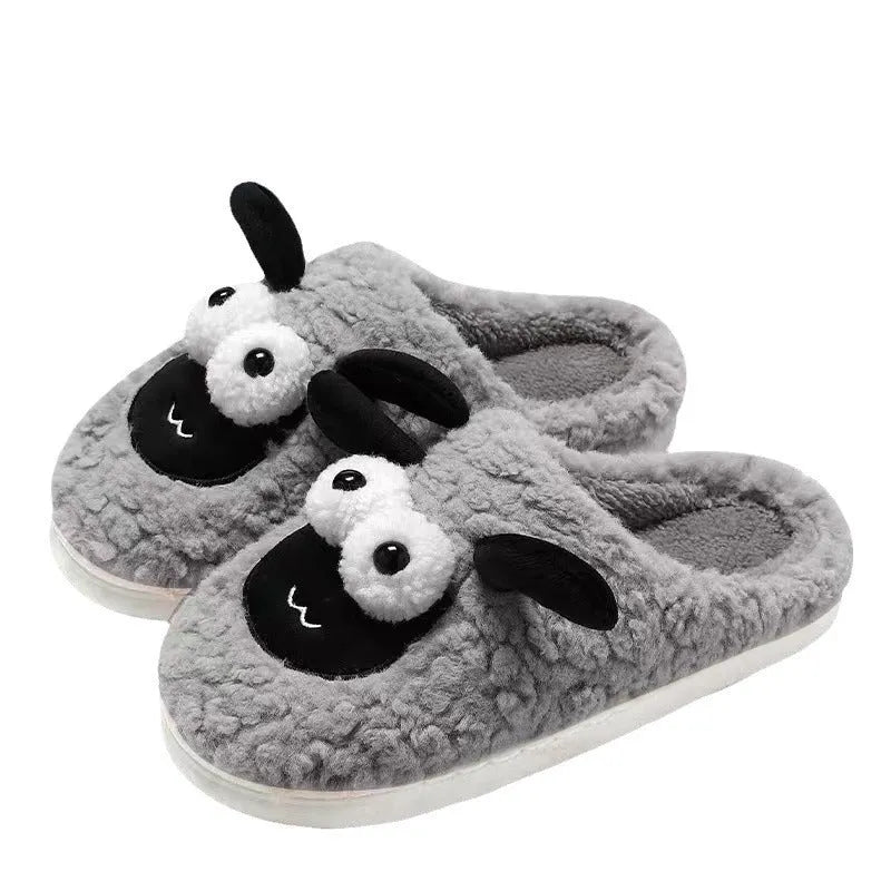 Brown lamb thermal cotton slip-on slippers with suede upper and PVC sole on a wooden floor.