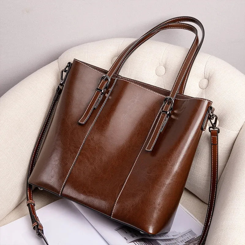 Genuine leather women's retro shoulder bag in brown with multiple compartments and straps