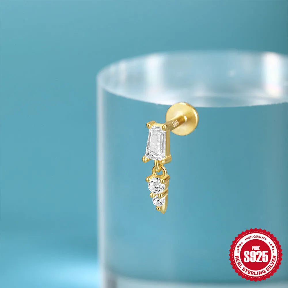 S925 sterling silver piercing ear stud with gold tone finish and XINGX inlaid tassel design