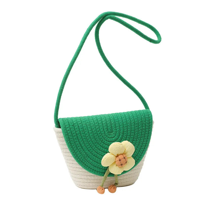 Women's cotton linen straw bucket bag with handwoven flower detail, crossbody strap, five colour options