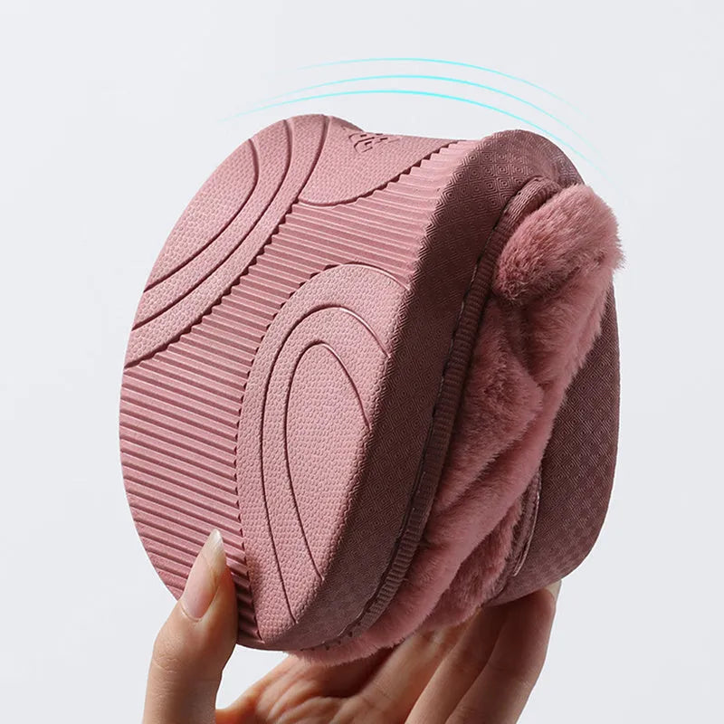 Unisex plush house slippers with white honeycomb-patterned PVC sole, showing round toe and plush inner lining in purple colour