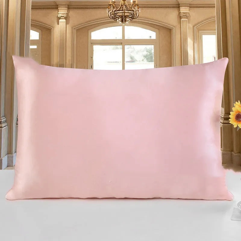 19 M double-sided silk pillowcase shown in one of 14 available colours, including apricot, sky blue, and black.