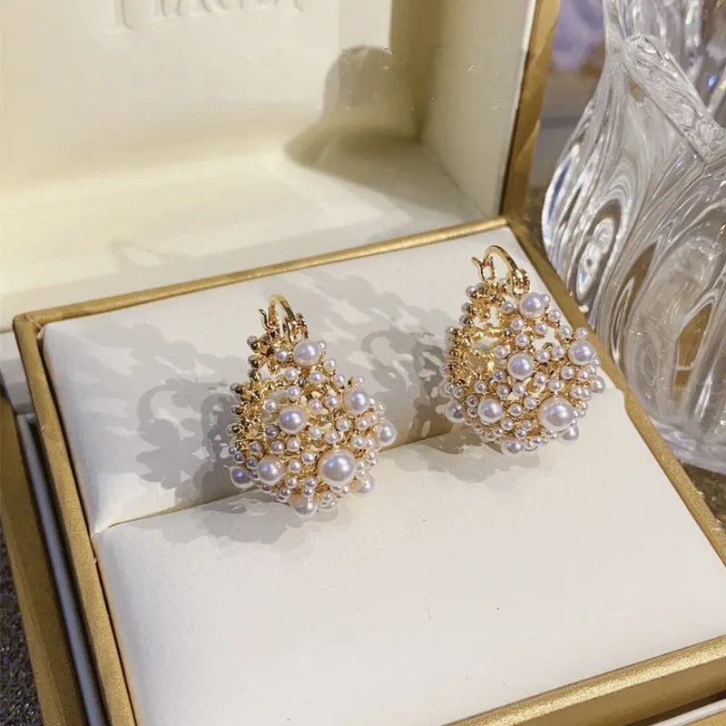 Women's gold flower basket earrings with small rice beads and pearl inlay on copper