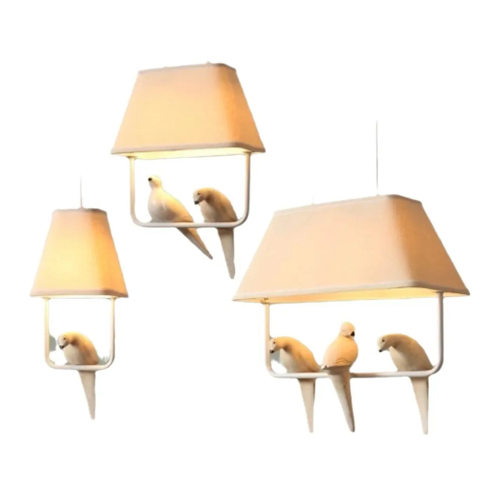 Iron ceiling chandelier with fabric shades featuring bird designs, hanging as a droplight.