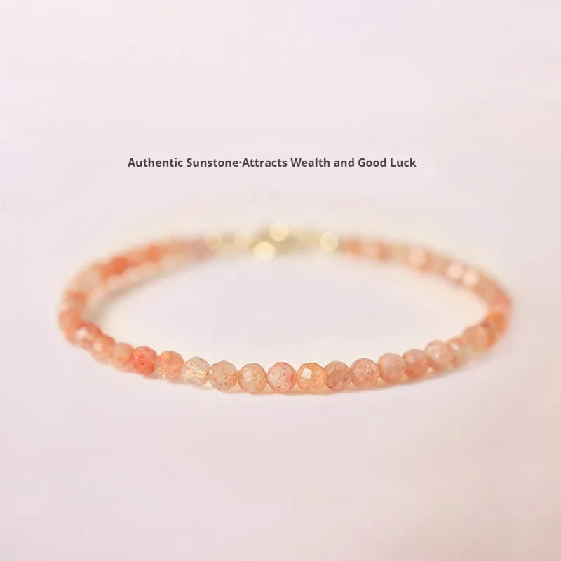 Close-up of a women's bracelet with small 3mm round sunstone beads on a string.