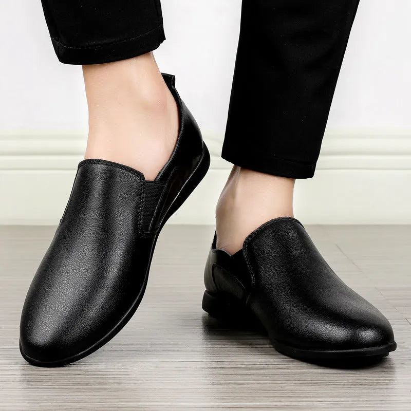 Men's black leather round-toe breathable business casual shoes on a white background.
