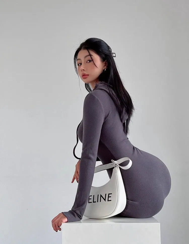 Women's grey hooded long sleeve sheath dress with a high waist on a model.
