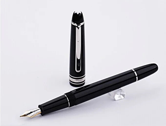 Black fountain pen with gold clip and two-colour nib, 0.7mm iridium tip, on a desk