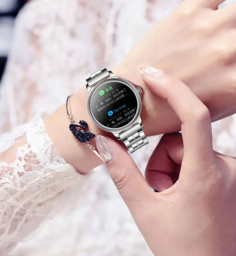AK38 ladies smart watch with metallic stainless steel strap and 1.09-inch colour screen.