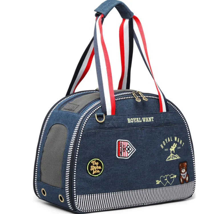 Blue denim pet carrier bag with cartoon pattern, measuring 43cm by 20cm by 30cm.