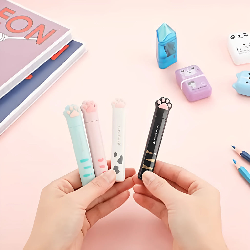 Cat paw design mini folding scissors in pink, showing stainless steel blades and compact size.