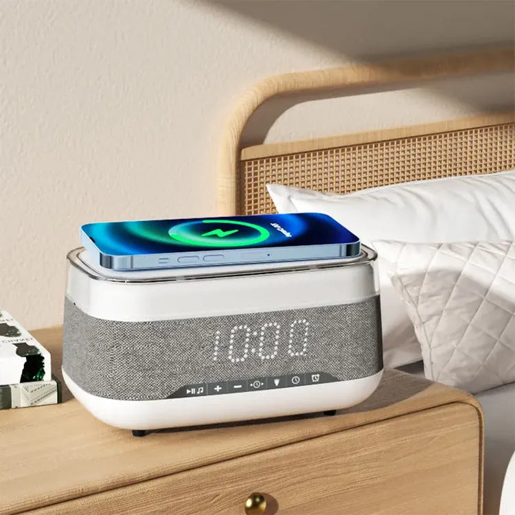 White multifunctional alarm clock with Bluetooth speaker and wireless charging pad