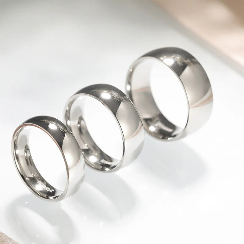Silver matte-finished titanium ring shown in 2mm, 4mm, and 6mm width options.