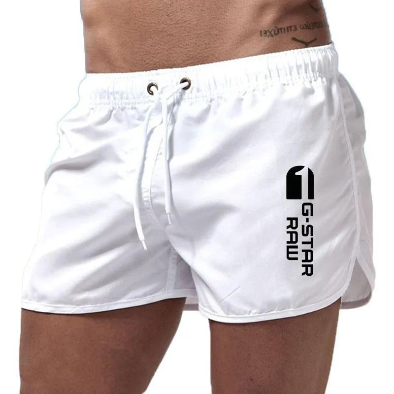 Man wearing thin polyester hemp blend beach shorts in fluorescent green, suitable for sports.
