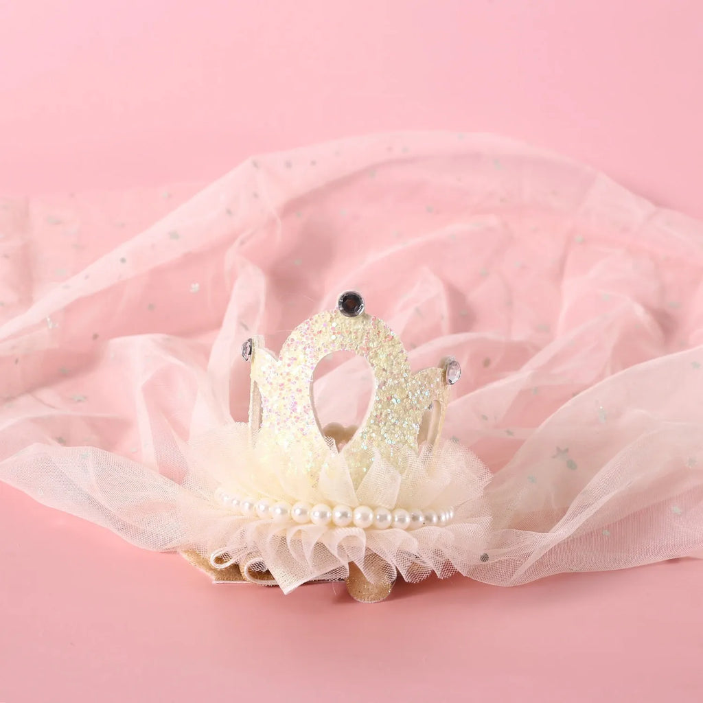 Pet cat wearing princess crown headdress with veil in beige or pink colour