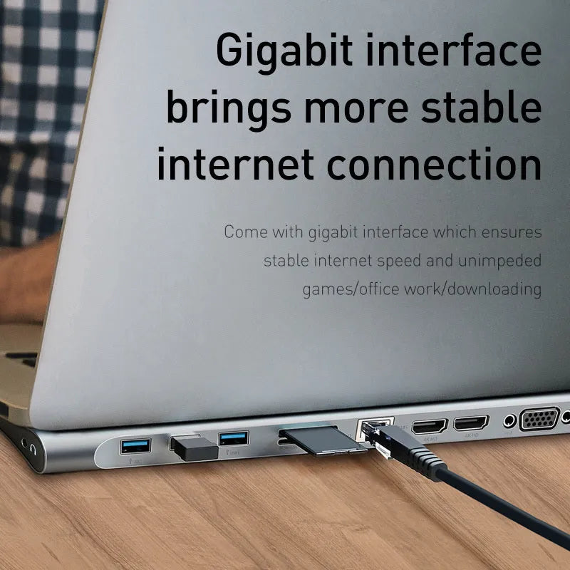 Grey aluminium USB C ten-port docking station with cooling bracket showing HDMI, VGA, and network ports