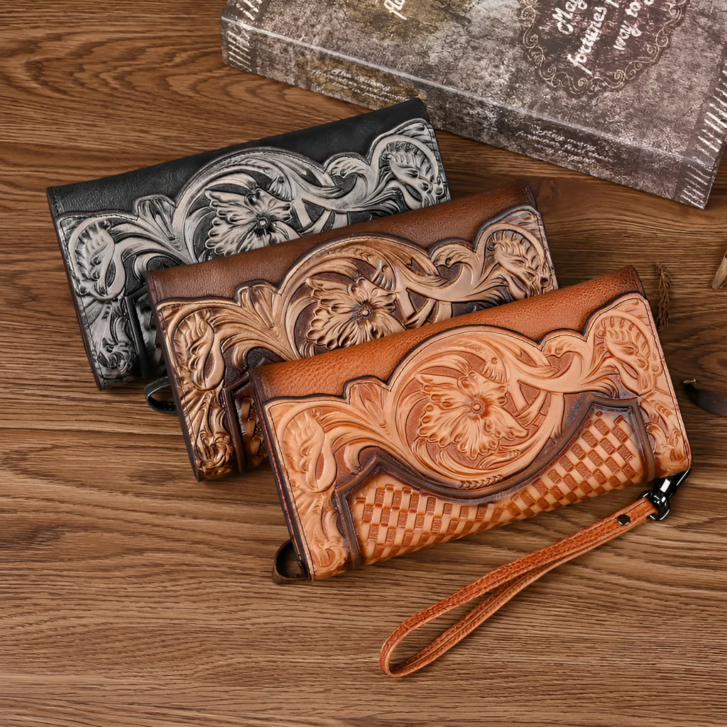 Women's brown cowhide tri-fold wallet with embossed floral pattern showing open compartments