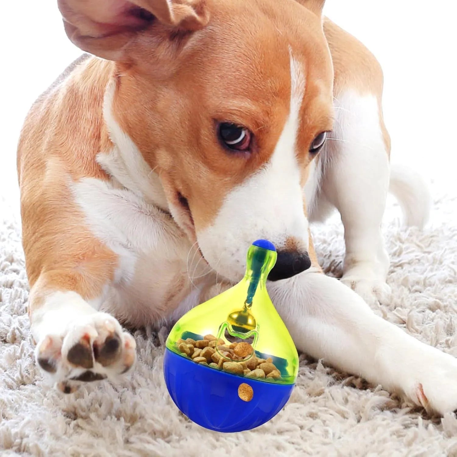 Tumbler-shaped interactive treat dispenser toy for dogs and cats on a floor.