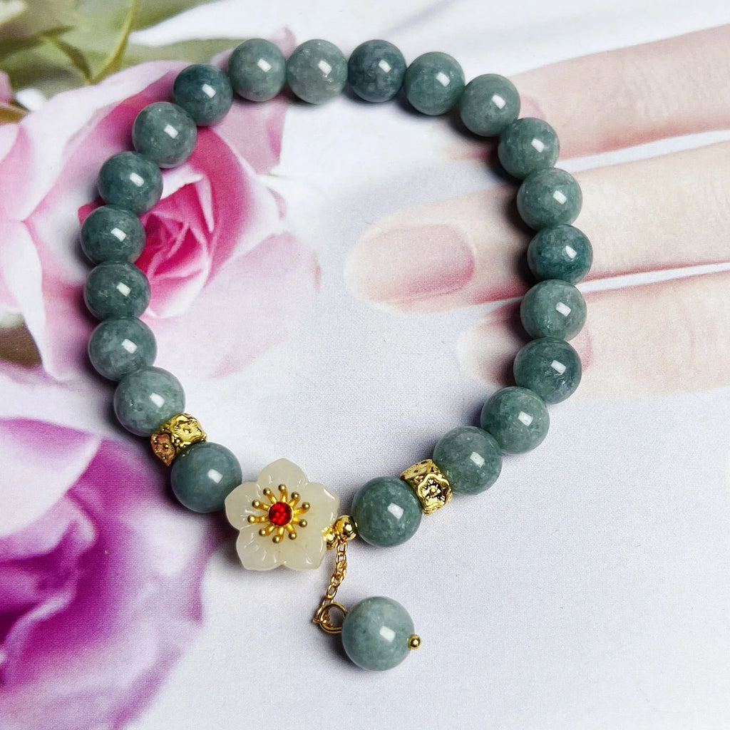 Women's retro style jade bracelet with adjustable rope closure on wrist