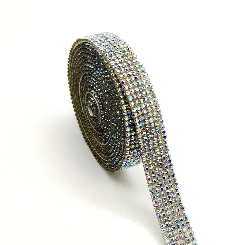 Self-adhesive strip with rows of sparkling electroplated glass rhinestones in white and iridescent colours