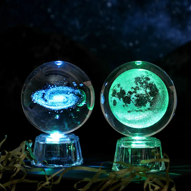 Transparent white crystal ball ornament with inner carving on wooden table with night lamp