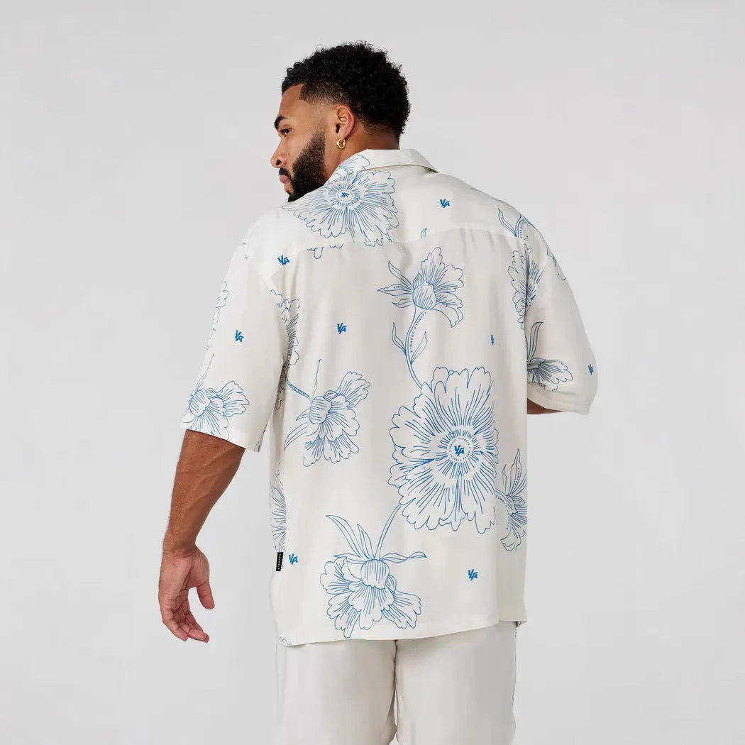 Men's loose fit short sleeve top with floral printed pattern in polyester fabric