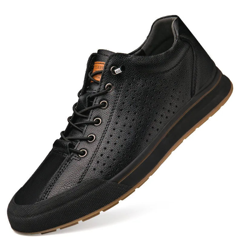 Men's white and black leather round toe flat casual trainers on a plain background.