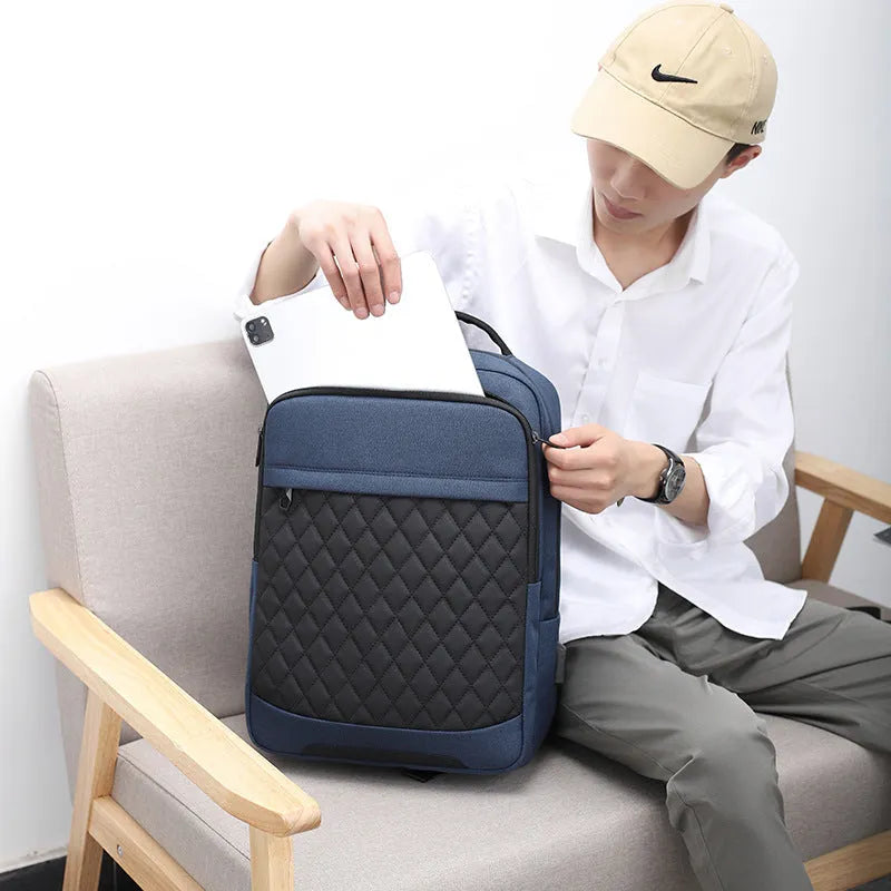 Men's Oxford cloth backpack in black, blue, or grey with curved straps and diamond mesh panels
