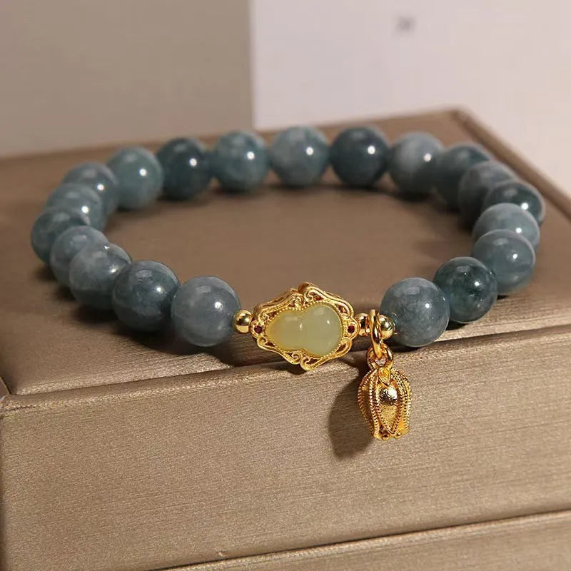 Women's natural stone bracelet with lotus flower gourd pendant in sky blue colour