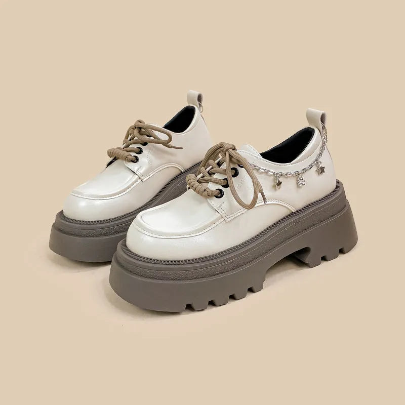 White platform leather shoes with chunky heel and round toe in British style