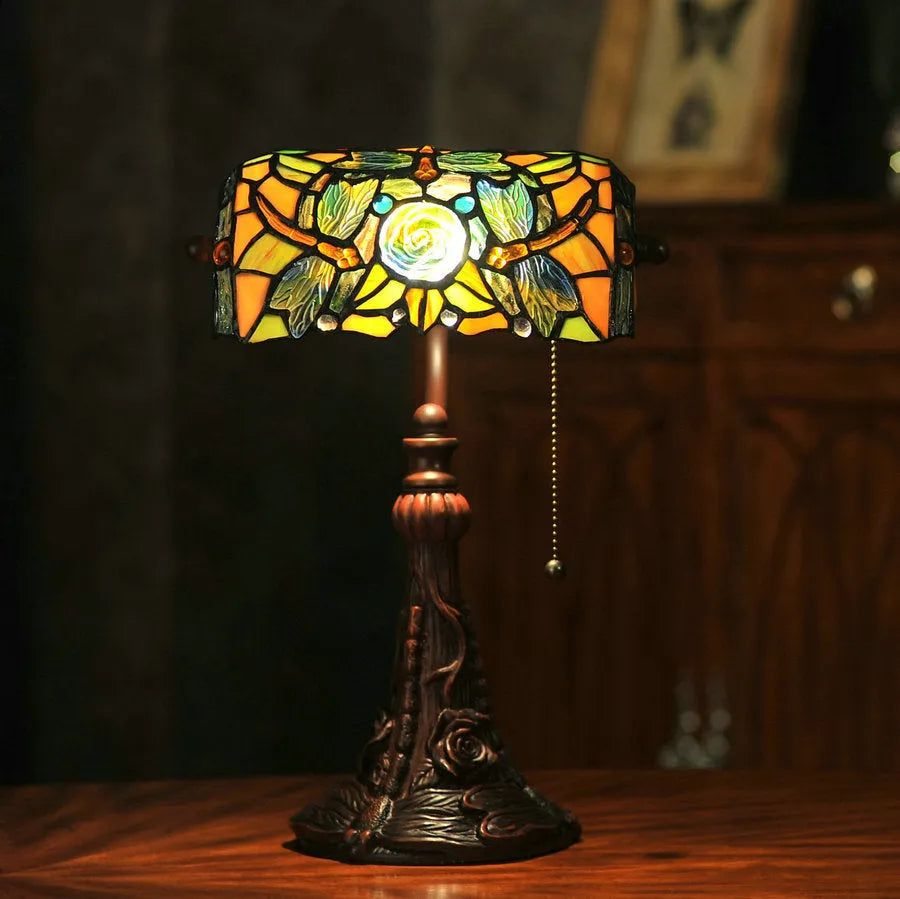 10-inch Tiffany stained glass table lamp with multicoloured glass and resin base on desk