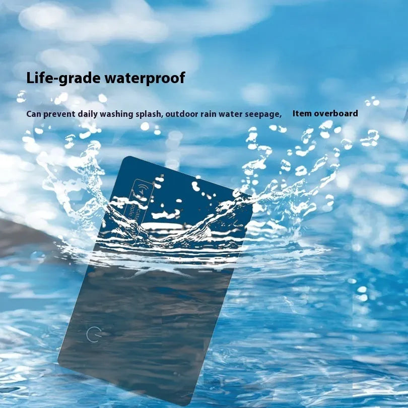 Black ultra-thin anti-loss alarm card for Apple devices with wallet placement