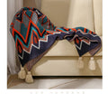 Bohemian-style acrylic sofa blanket with tassel fringe in geometric pattern colour option