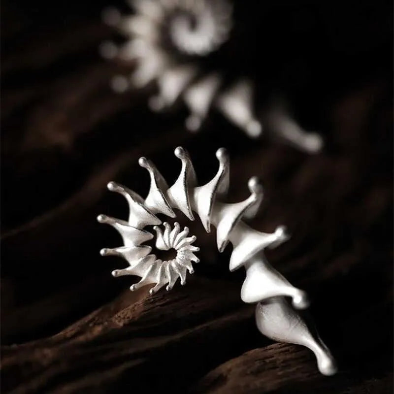 Conch colour three-dimensional matte alloy stud earrings with irregular geometric design