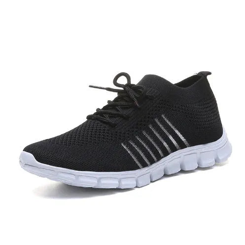 Women's breathable lace-up sneaker in a low-top style with a flat rubber sole.