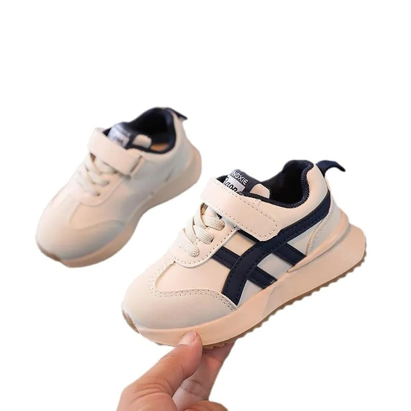 Children's white casual sneakers with Velcro fastening, synthetic leather upper, and rubber sole